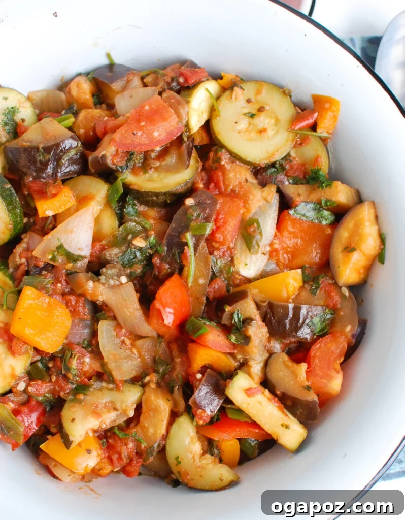 The Ultimate Ratatouille: Fresh, Flavorful, French 2 Best Ratatouille Recipe in a white serving bowl, garnished with fresh herbs