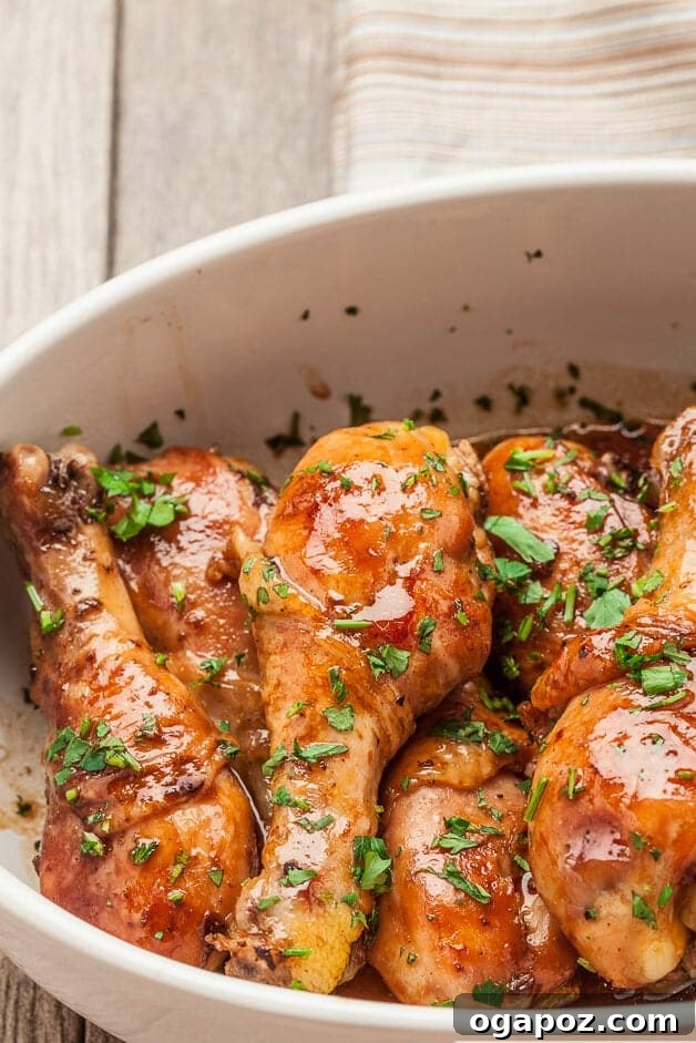 41 Delicious Chicken Drumstick Recipes: Simple and Super Juicy 13 Honey Soy Chicken stacked on a dish