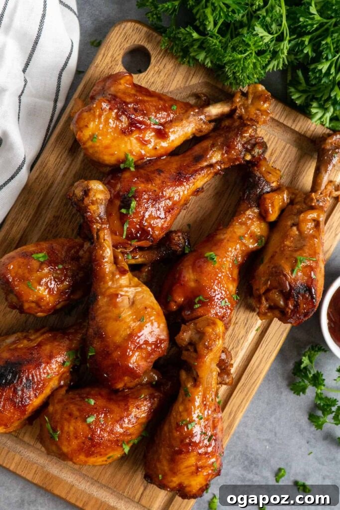 41 Delicious Chicken Drumstick Recipes: Simple and Super Juicy 17 Slow Cooker BBQ Chicken Drumsticks on a wooden cutting board
