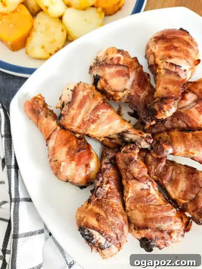 41 Delicious Chicken Drumstick Recipes: Simple and Super Juicy 20 Oven-Baked Bacon Wrapped Drumsticks served on a plate