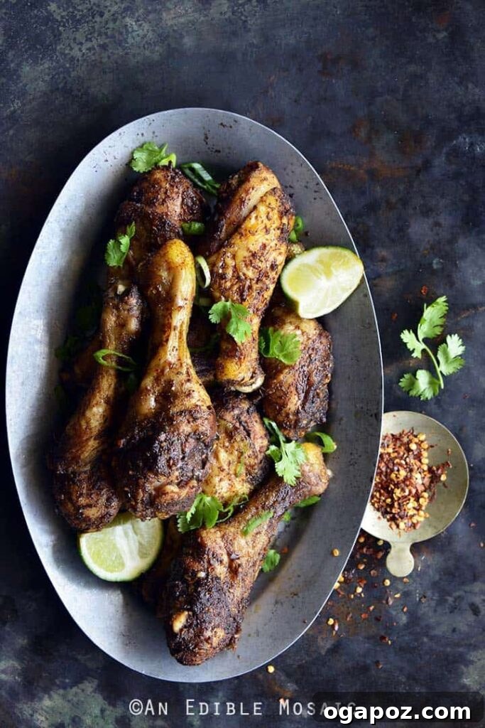 41 Delicious Chicken Drumstick Recipes: Simple and Super Juicy 29 Jamaican Jerk Chicken Drumsticks served with sliced lime wedges and chili flakes