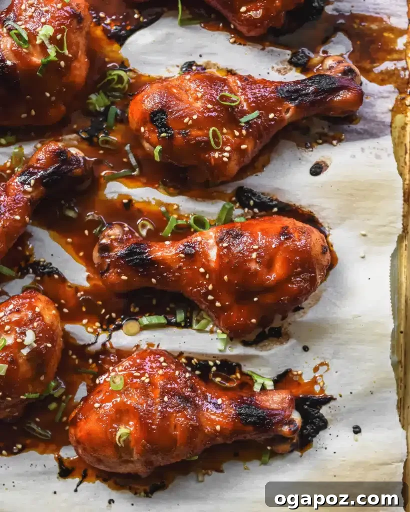 41 Delicious Chicken Drumstick Recipes: Simple and Super Juicy 8 Spicy Gochujang Chicken Drumsticks on a sheet pan