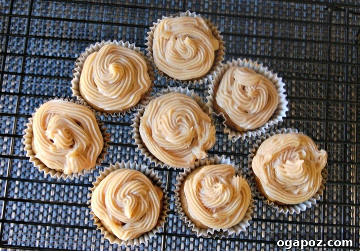 Maple-Cinnamon Cloud Pumpkin Cupcakes 3 Delicious cupcakes - Pumpkin Cupcakes with Maple Cinnamon Cream Cheese Frosting arranged on a platter