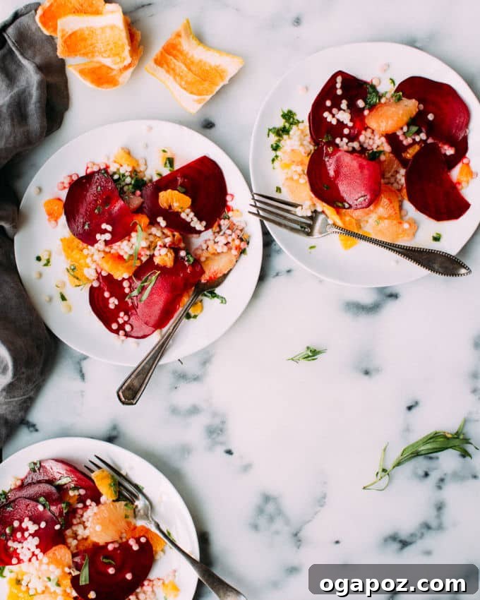 9+ Phenomenal Israeli Couscous Recipes You Must Try 6 An artistic presentation of Israeli couscous salad with earthy beets and bright oranges, creating a visually appealing and flavorful dish.