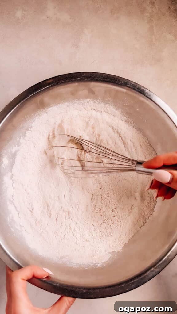 Cloud-Soft Pumpkin Cupcakes 5 All-purpose flour in a mixing bowl, ready for baking.