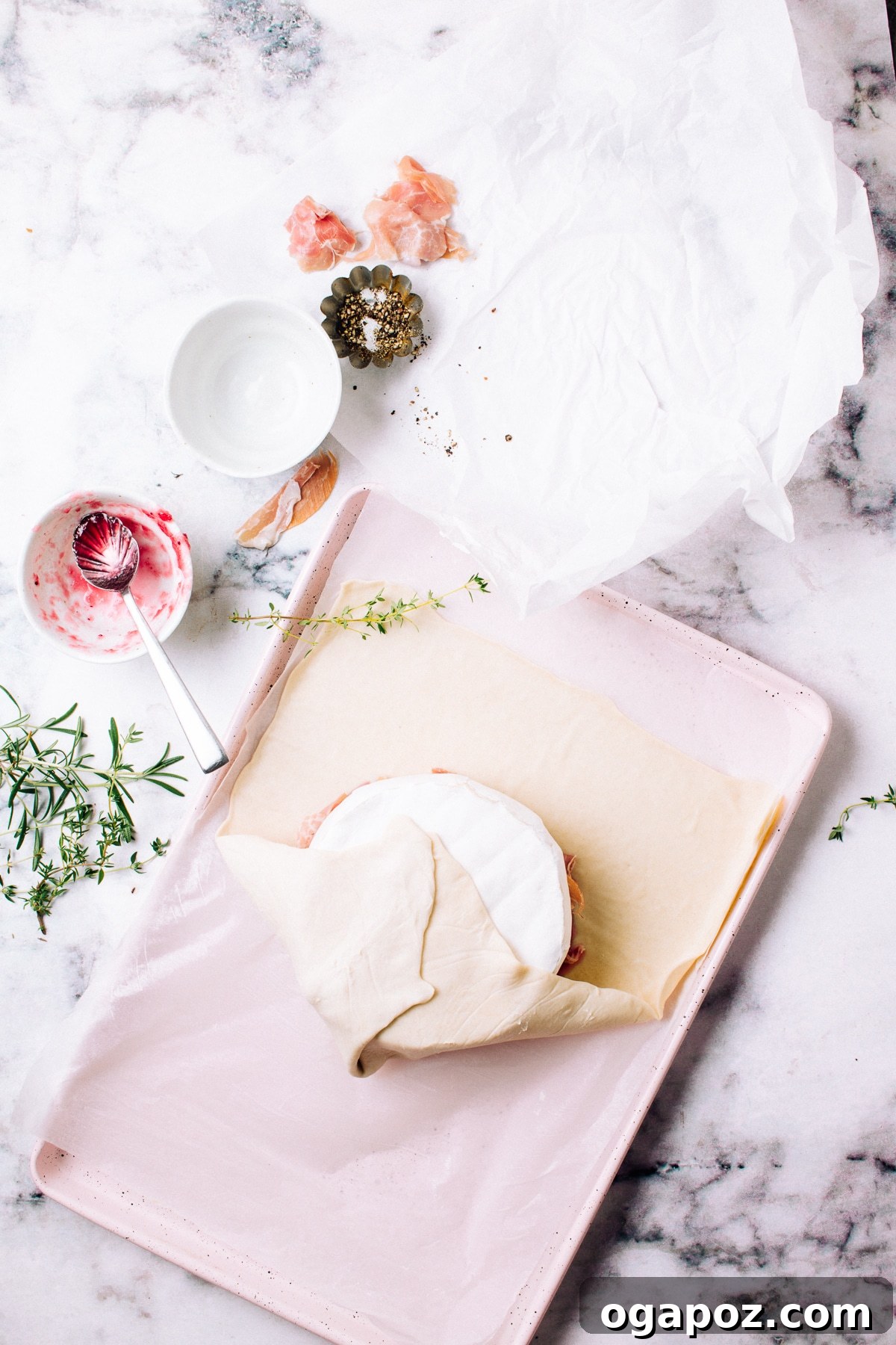 Gourmet Brie & Prosciutto Puff Pastry with Cranberries 7 Using parchment paper to shape the puff pastry baked brie