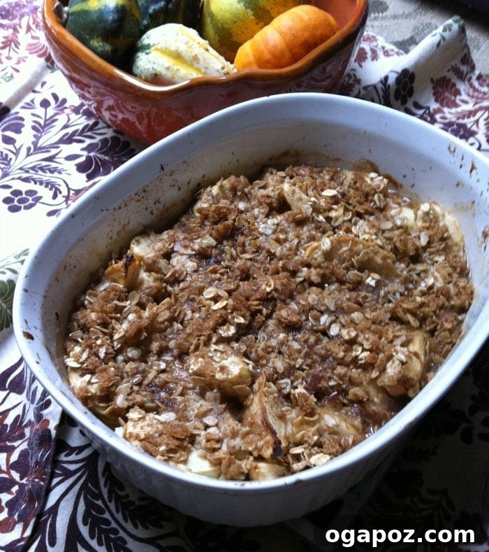 Warm Apple Crumble 4 Freshly baked apple crisp, golden brown and bubbling, just out of the oven, showing its delicious texture.
