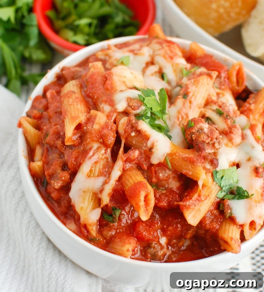 Creamy Ricotta Baked Ziti 3 Individual serving of Baked Ziti with Ricotta in a white bowl, garnished with fresh herbs