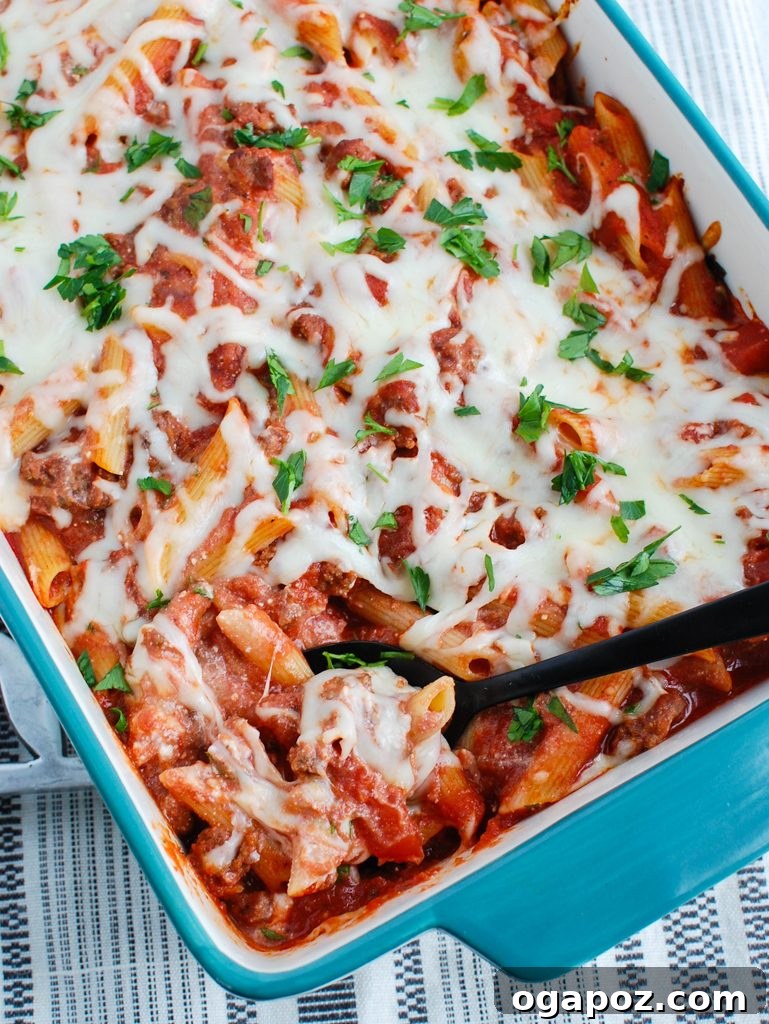 Creamy Ricotta Baked Ziti 5 Baked Ziti with Ricotta being scooped with a large serving spoon