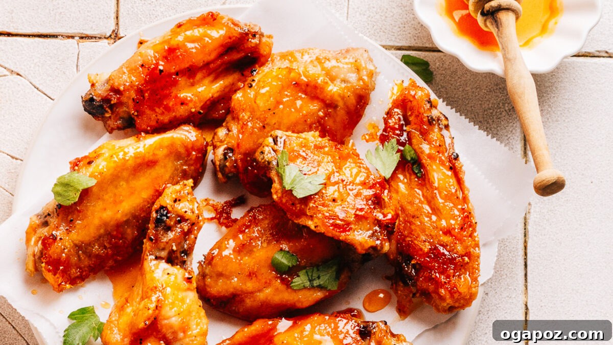Ultimate Game Day Grub 2 A plate of wings with hot honey sauce.