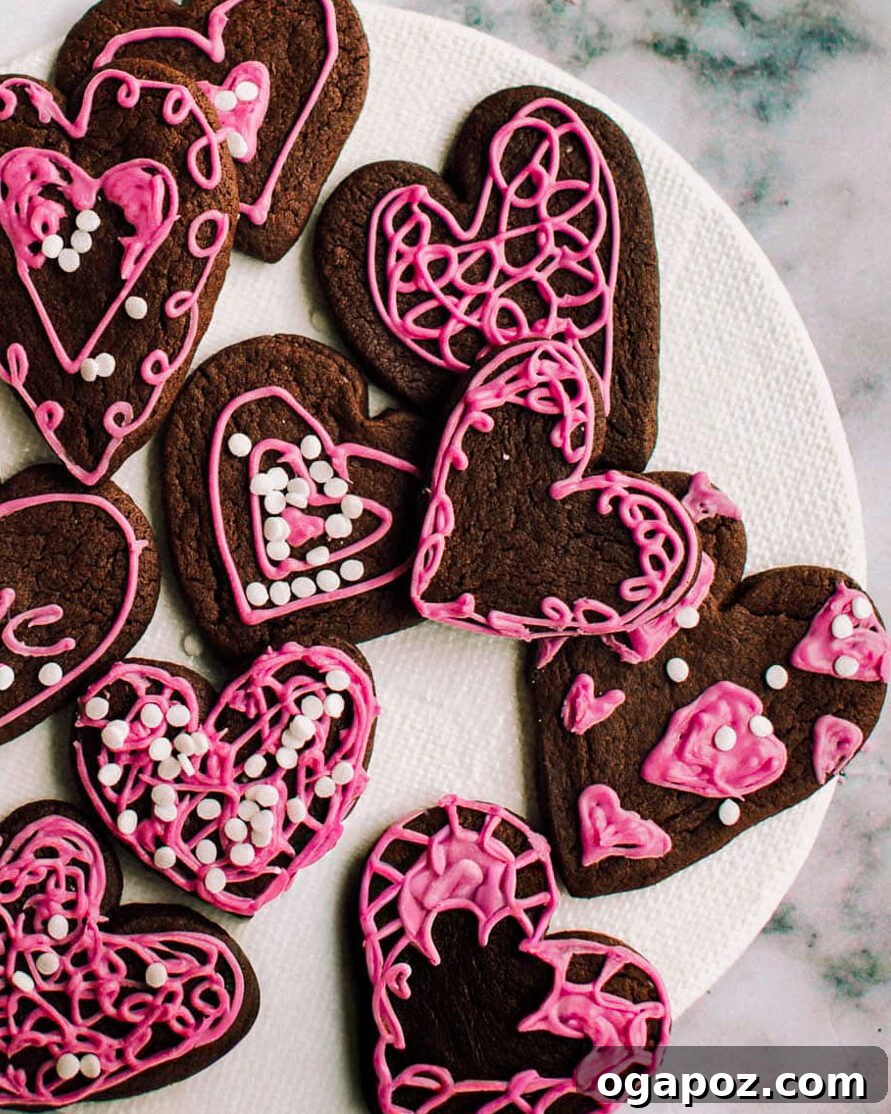 Heart-shaped chocolate Valentine's cookies on a plate.