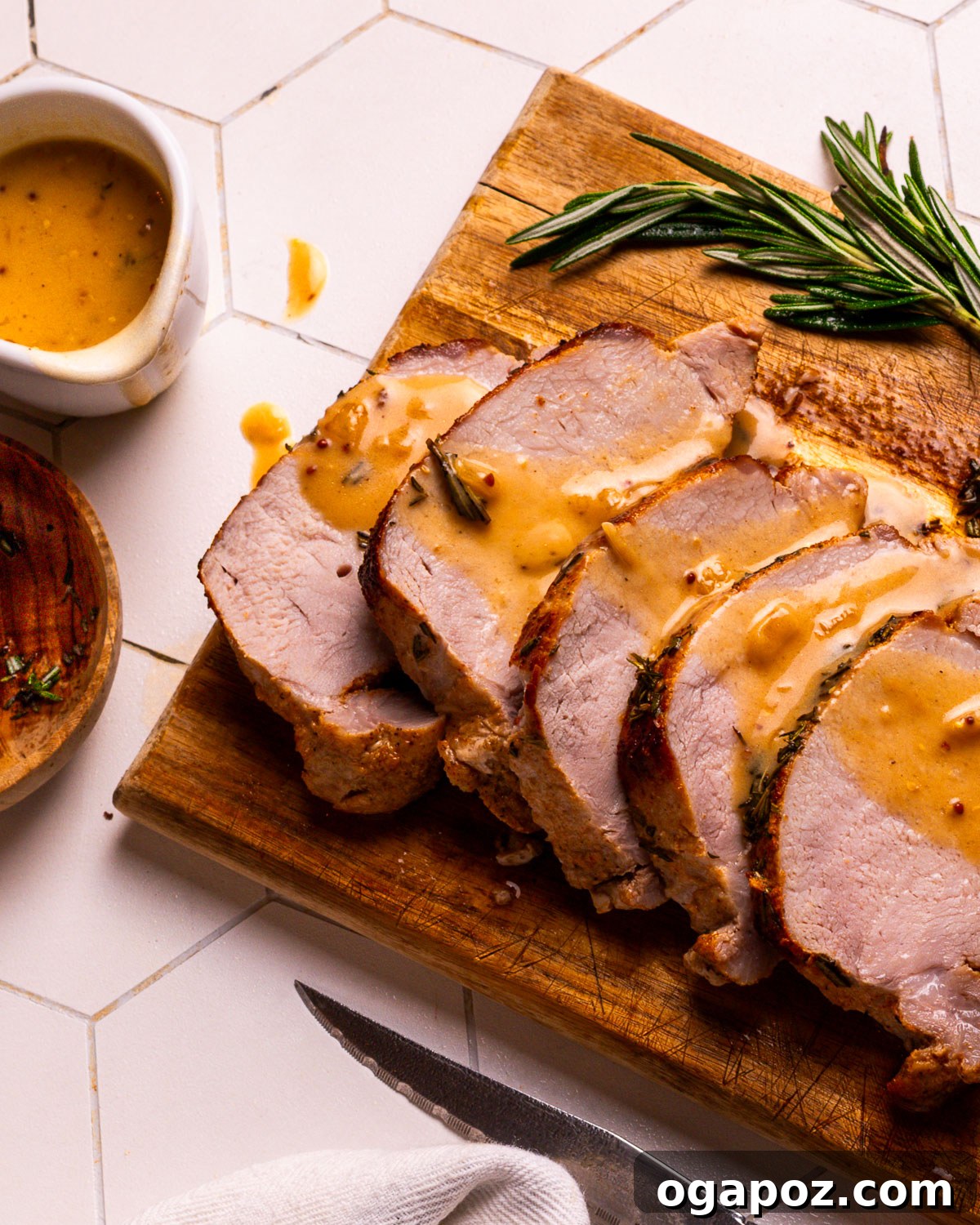 Classic Homemade Pork Gravy 2 A serving of perfectly roasted pork loin slices generously covered with creamy homemade pork gravy.