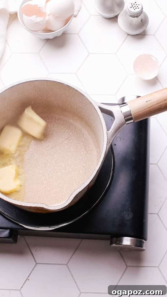 Classic Homemade Pork Gravy 4 Adding butter to a saucepan for making gravy.