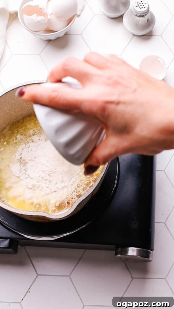 Classic Homemade Pork Gravy 5 Adding flour to melted butter in making a roux for gravy.