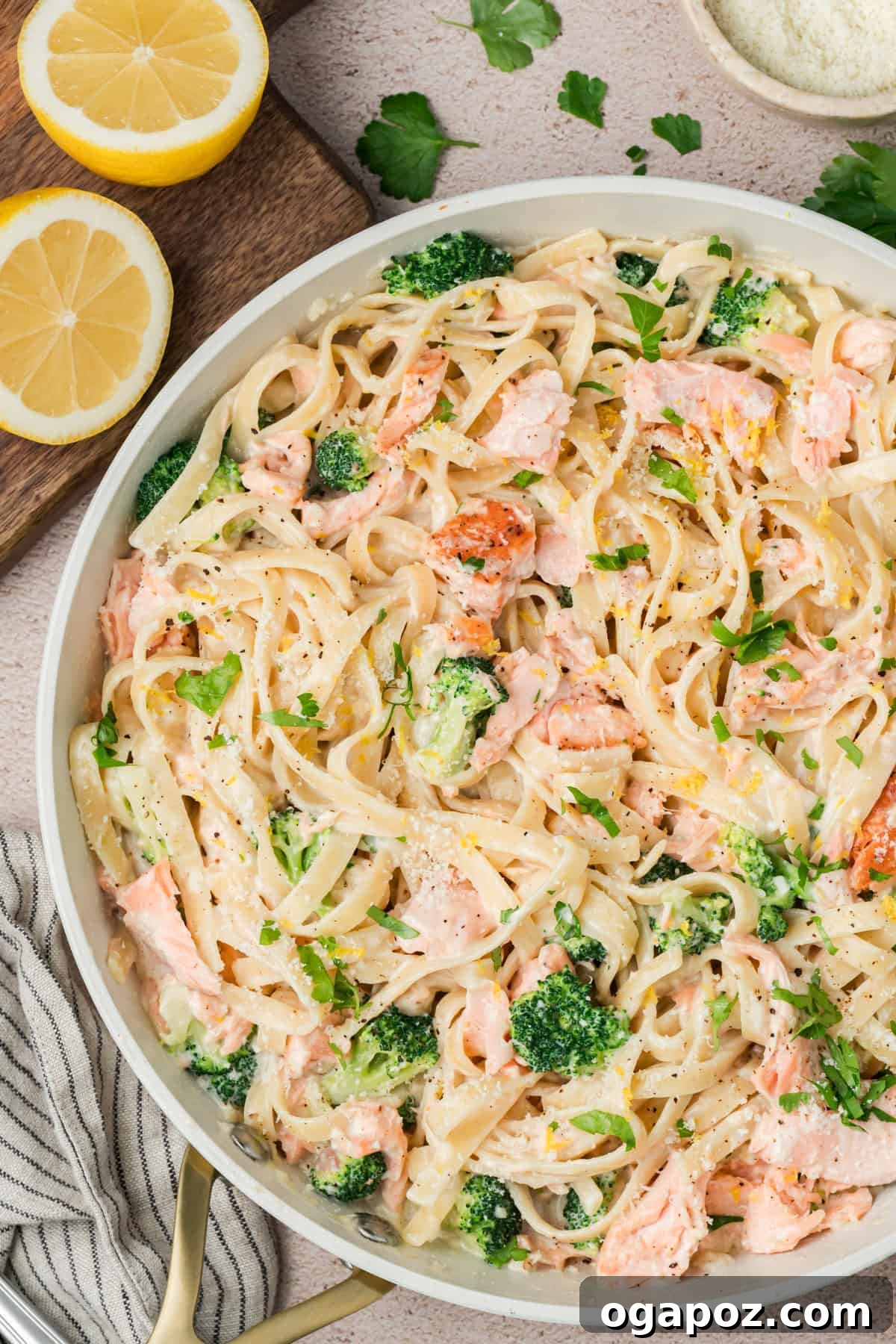 Velvety Salmon Alfredo Pasta 2 Creamy Alfredo Salmon Pasta served in a bowl with broccoli and Parmesan cheese