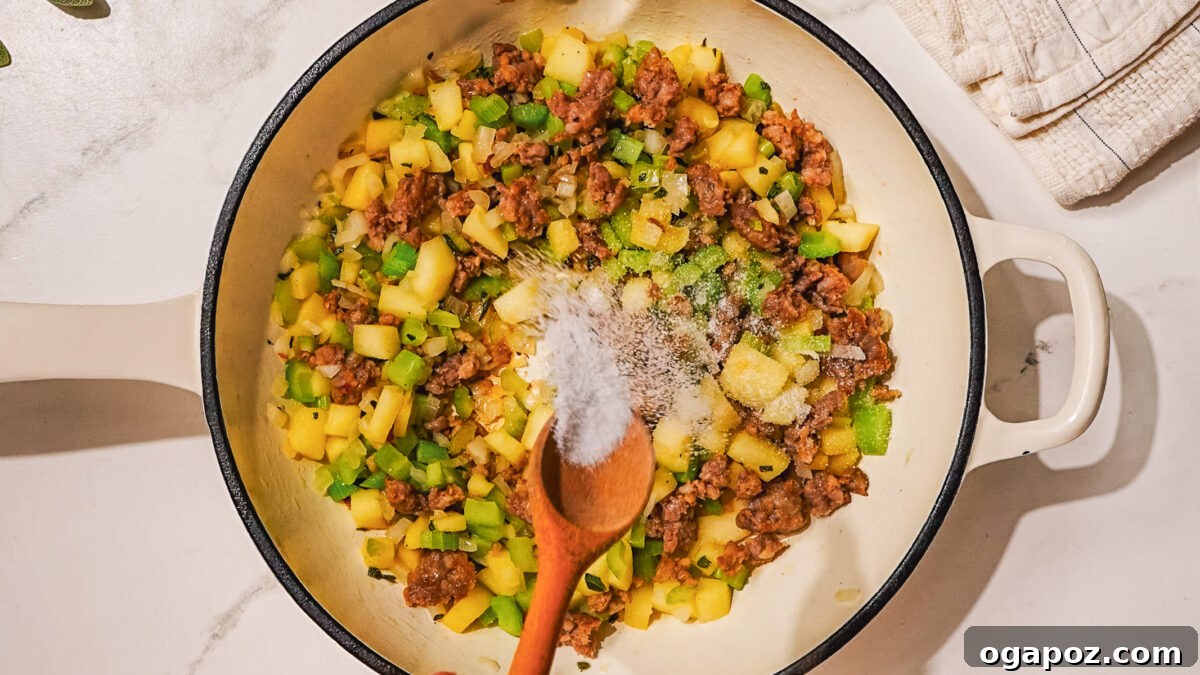 Signature Stuffed Pork Chops with an Unforgettable Pan Sauce 4 Step 1: Browning Italian sausage in a skillet for the stuffing.