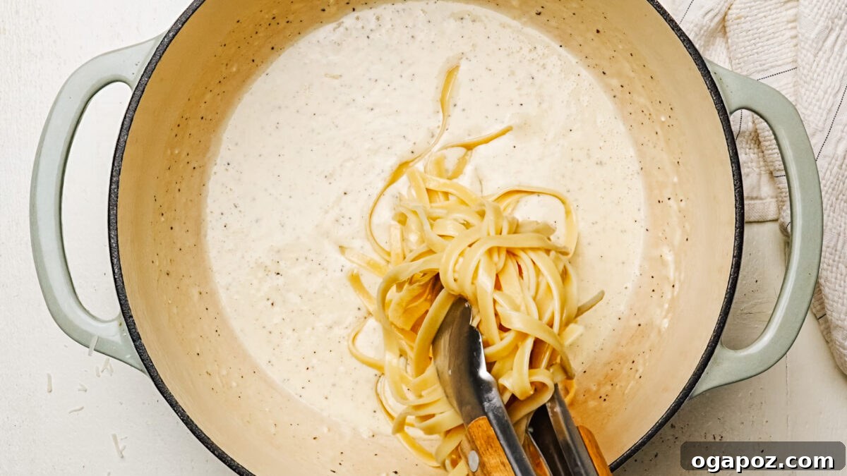 Rich and Creamy Chicken Alfredo 6 Tossing perfectly cooked fettuccine noodles in a rich, creamy Alfredo Sauce until thoroughly coated.