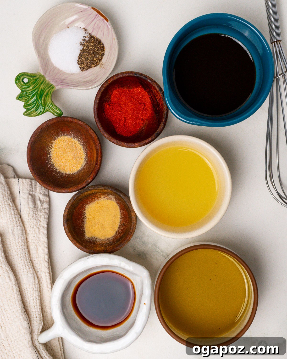 Irresistibly Juicy Pork Tenderloin Marinade 3 All the pre-measured ingredients for the pork tenderloin marinade laid out on a kitchen counter in mise en place style.