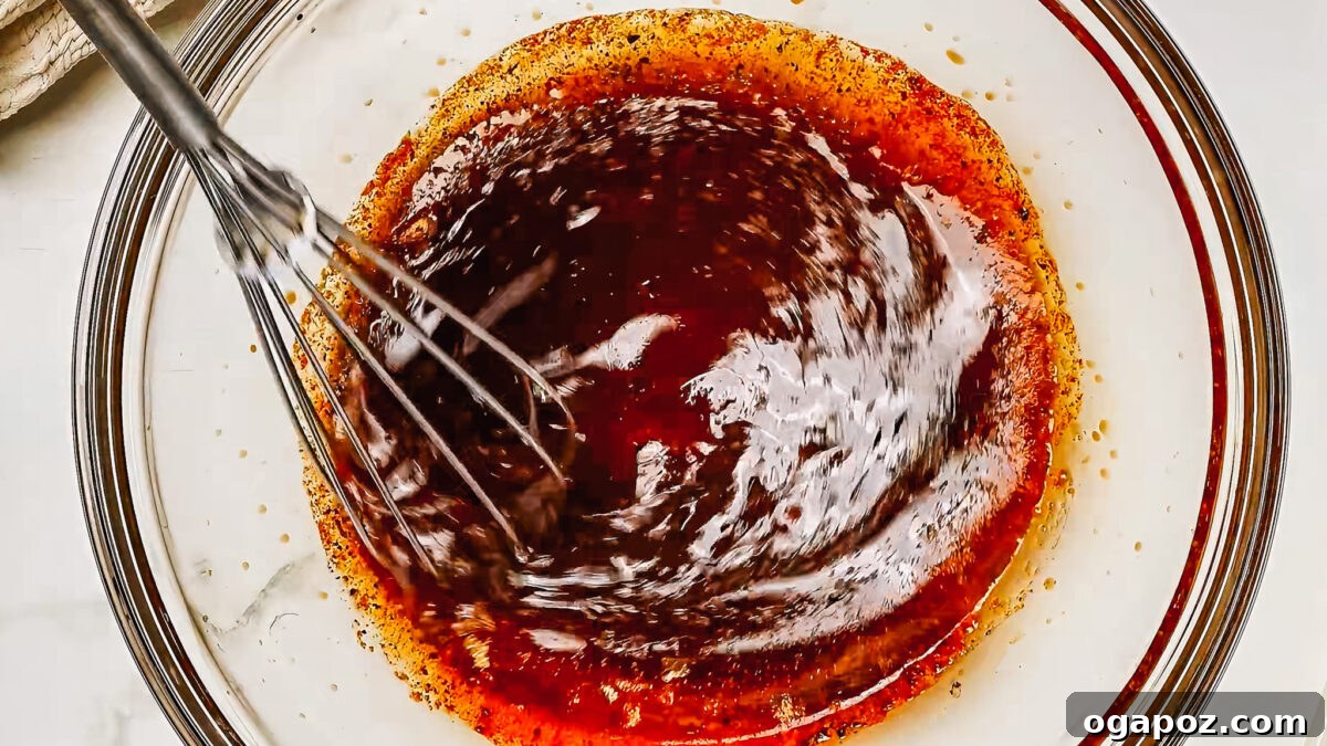 Irresistibly Juicy Pork Tenderloin Marinade 4 Whisking pork tenderloin marinade ingredients together in a bowl.