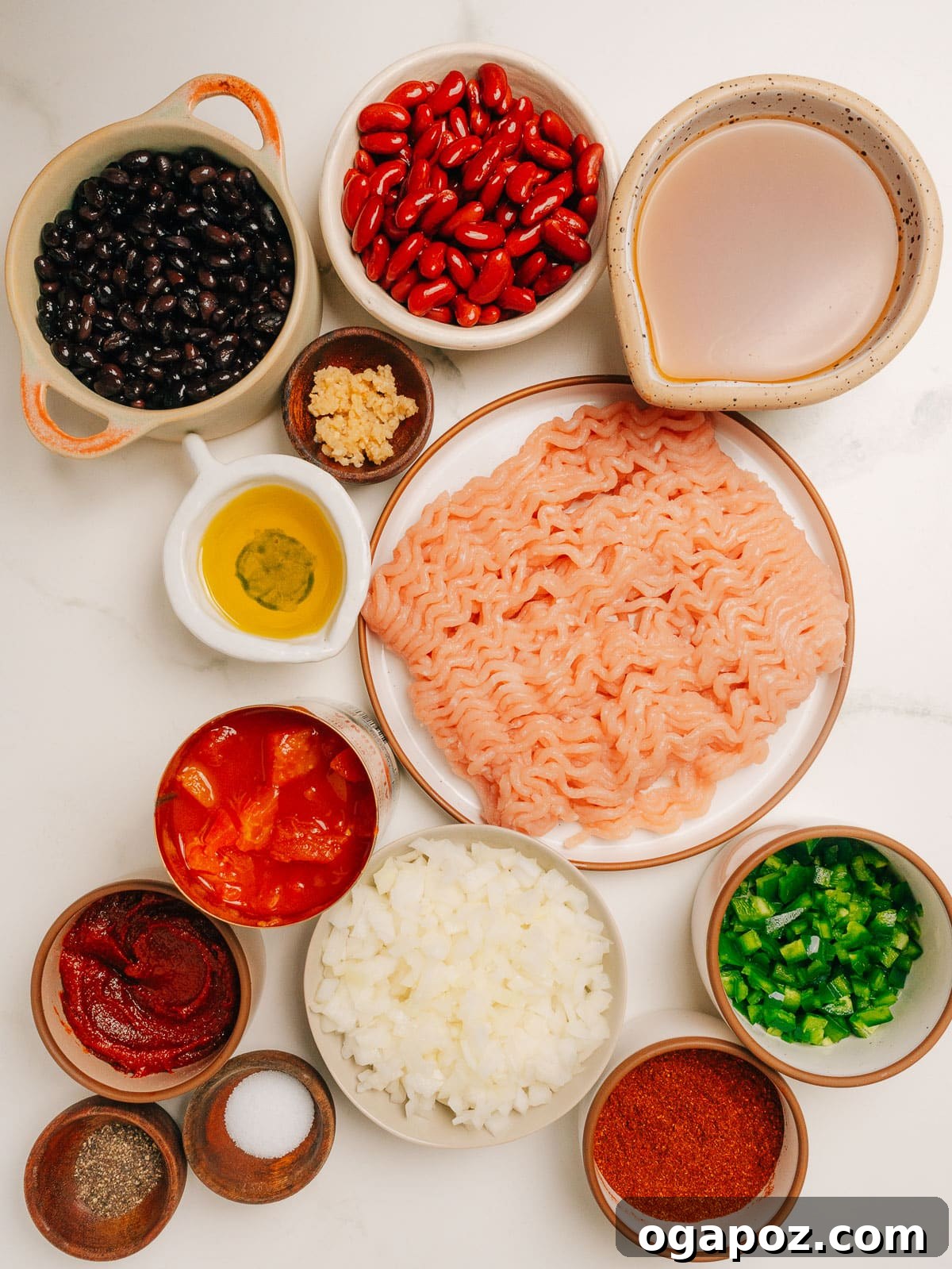 Turkey Chili Crockpot Recipe Ingredients neatly arranged on a kitchen counter, ready for preparation.
