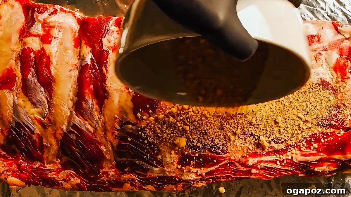 Fall-Off-The-Bone Oven Ribs 6 Step 2: Seasoning beef back ribs with dry rub.