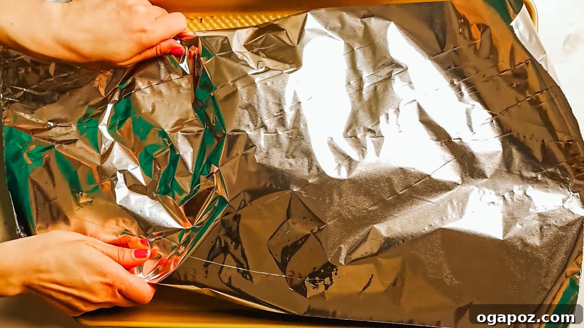 Fall-Off-The-Bone Oven Ribs 7 Step 3: Beef back ribs wrapped tightly in foil, ready for baking.