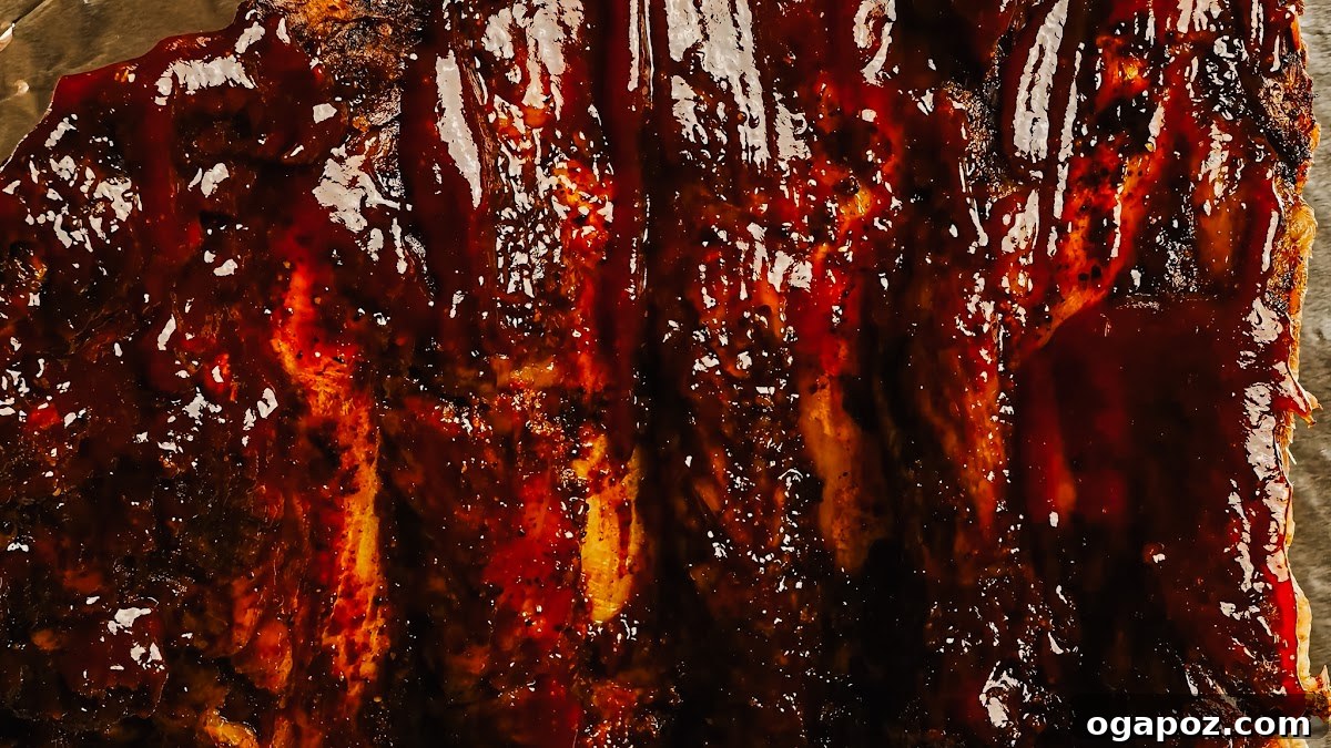 Fall-Off-The-Bone Oven Ribs 8 Step 4: Oven-baked beef back ribs, glazed with BBQ sauce and lightly broiled.