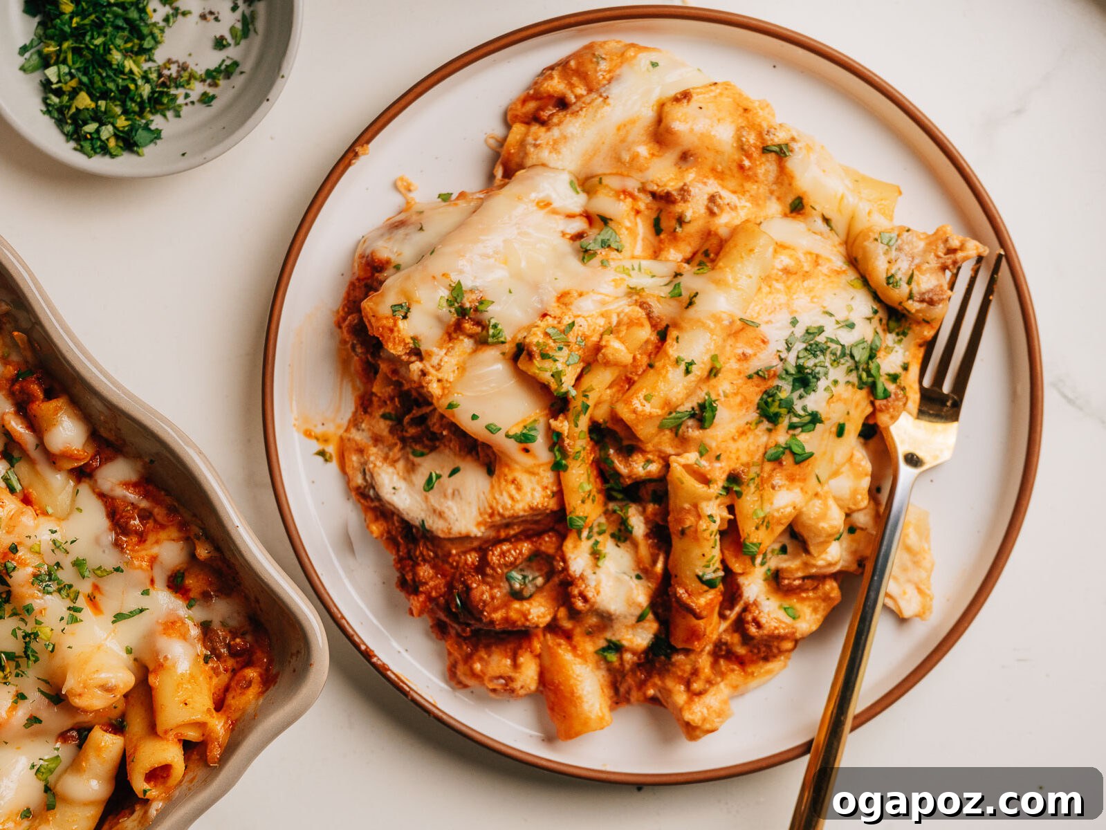 Creamy Ricotta Baked Ziti 11 A generous serving of baked ziti with ricotta, showcasing the layered perfection and rich textures, ready to be enjoyed as a hearty meal.