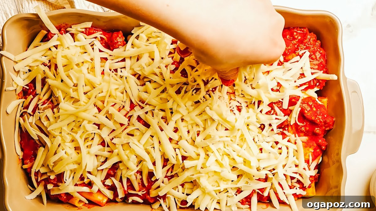 Creamy Ricotta Baked Ziti 8 Meat sauce simmering gently, allowing all the flavors to meld and develop into a rich, cohesive sauce for the ziti.