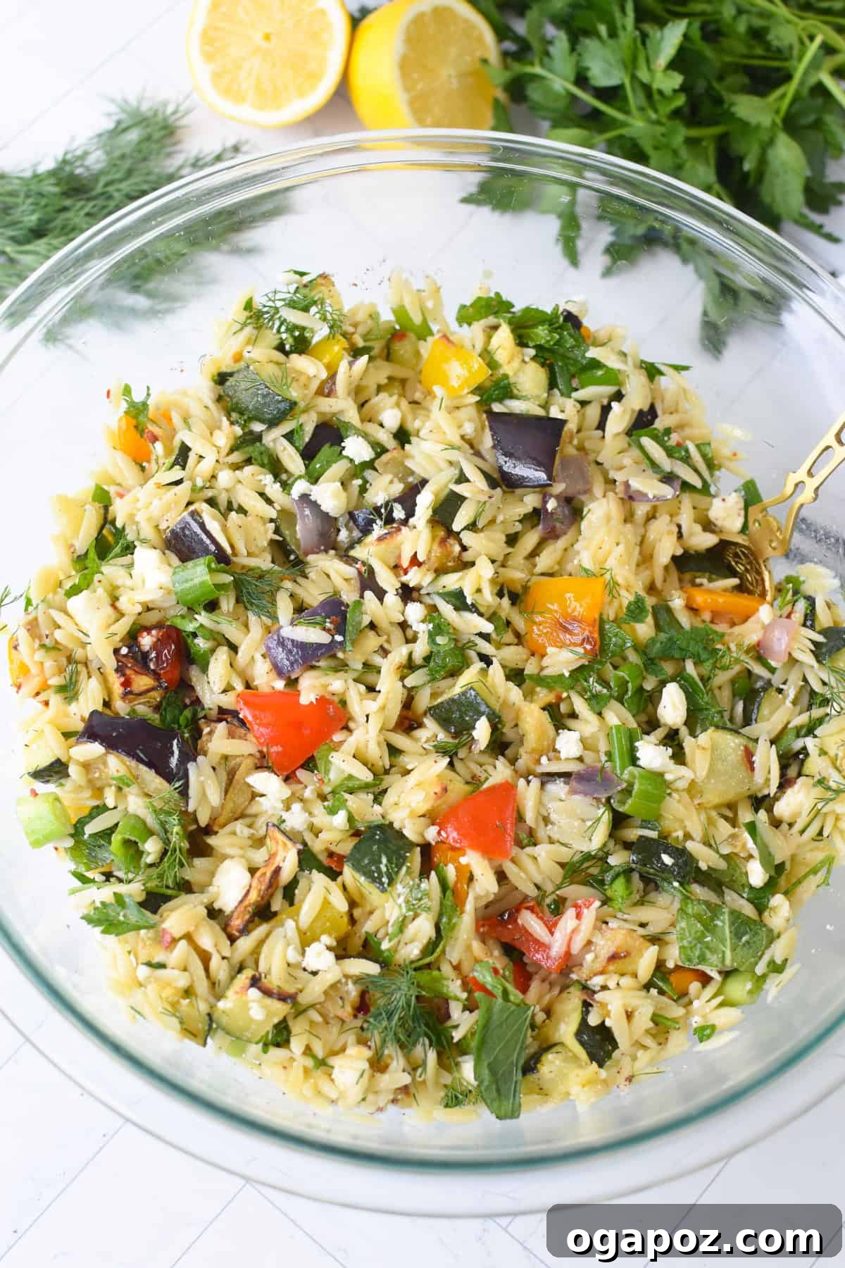 Mediterranean Roasted Vegetable Orzo Salad with Feta 9 Close-up of the assembled Mediterranean orzo salad with feta and fresh herbs, ready for serving
