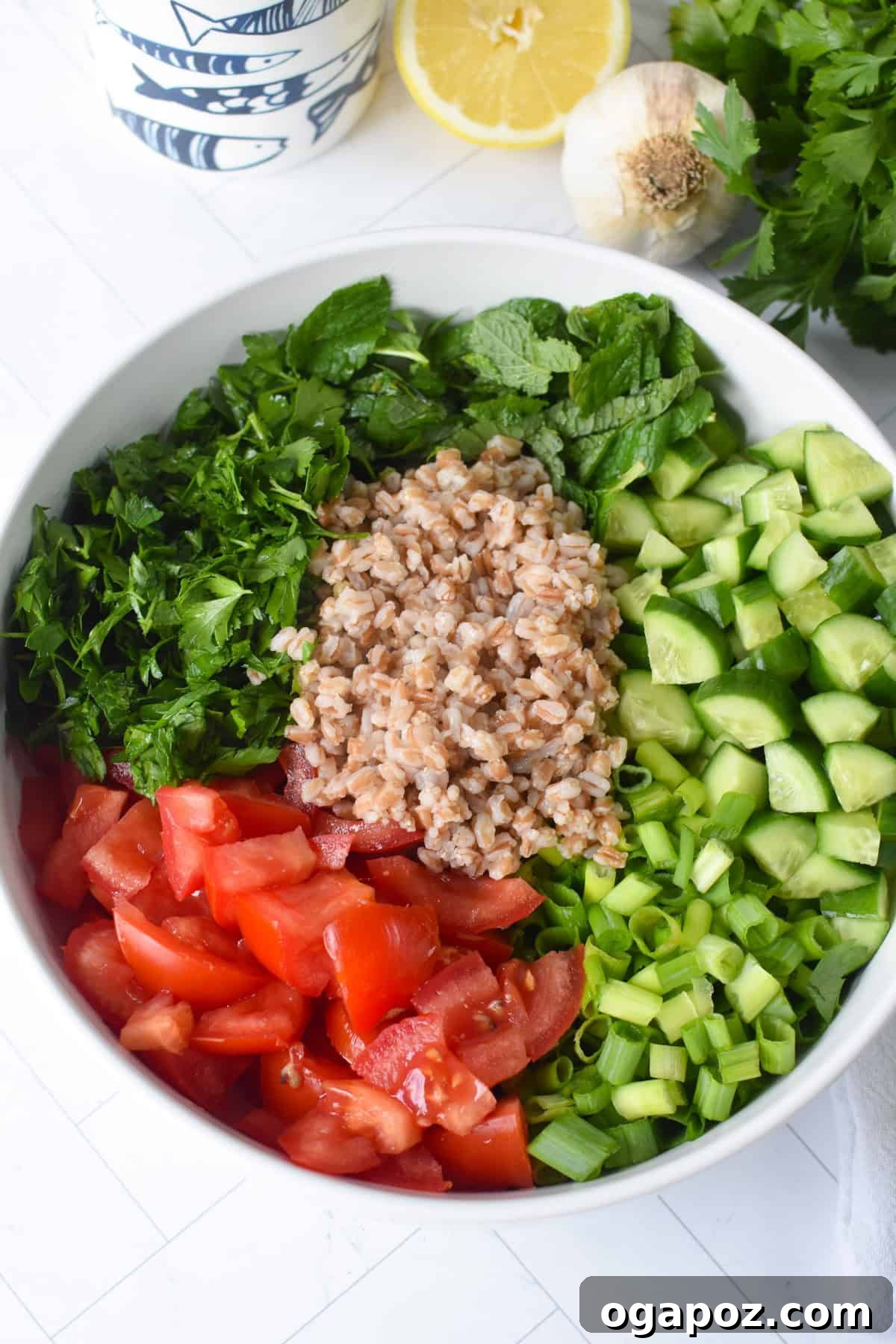 Vibrant Farro Tabbouleh 7 A simple yet vibrant Farro Tabbouleh Salad displayed in a clear glass bowl, highlighting the fresh ingredients and inviting colors.