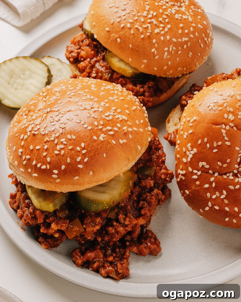 Classic Sloppy Joes Recipe: Savory Ground Beef Sandwiches 2 Easy sloppy joes recipe in buns on a plate.