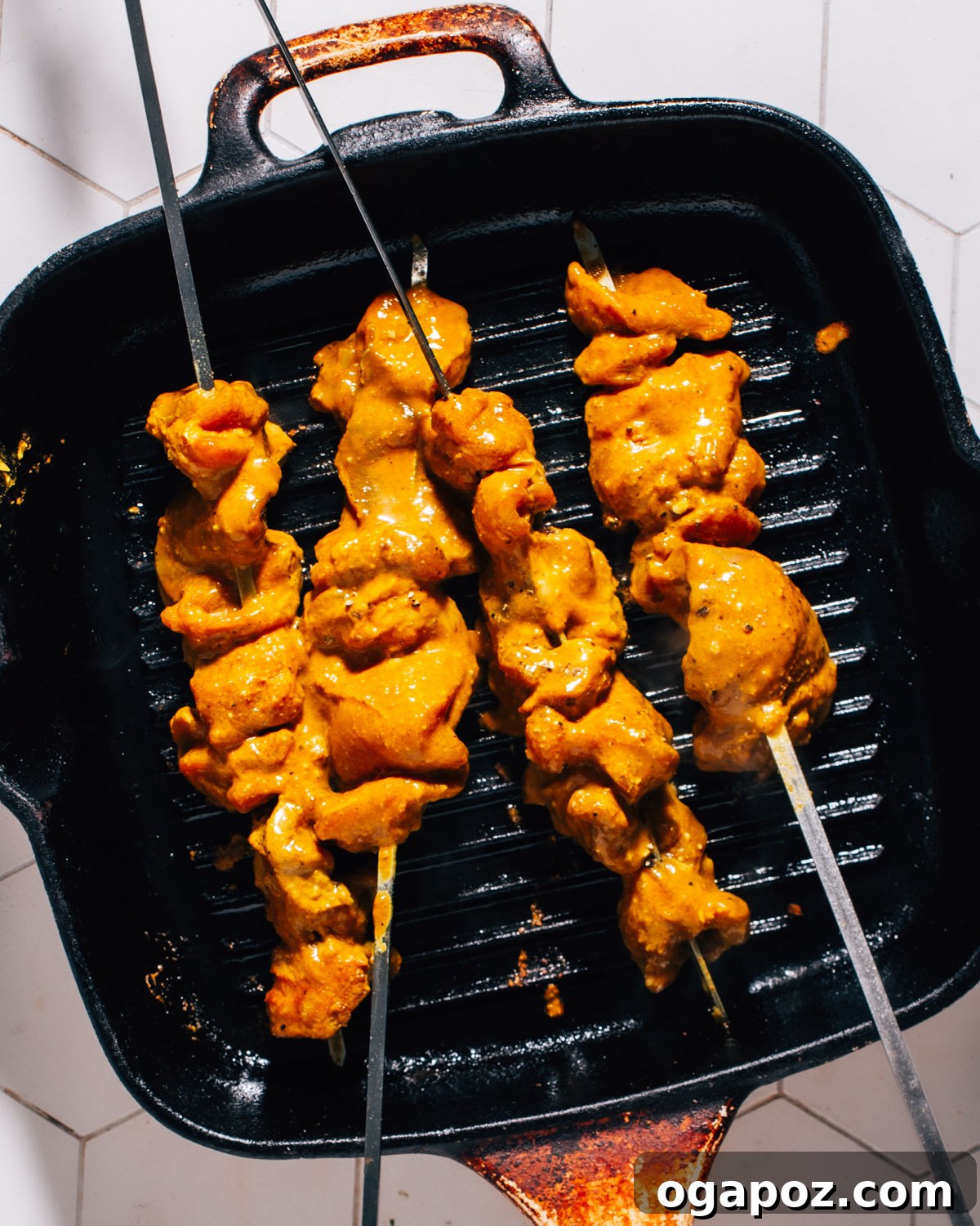 Juicy Turkey Tikka with Cooling Cucumber Raita 5 Cooking chicken kebabs.
