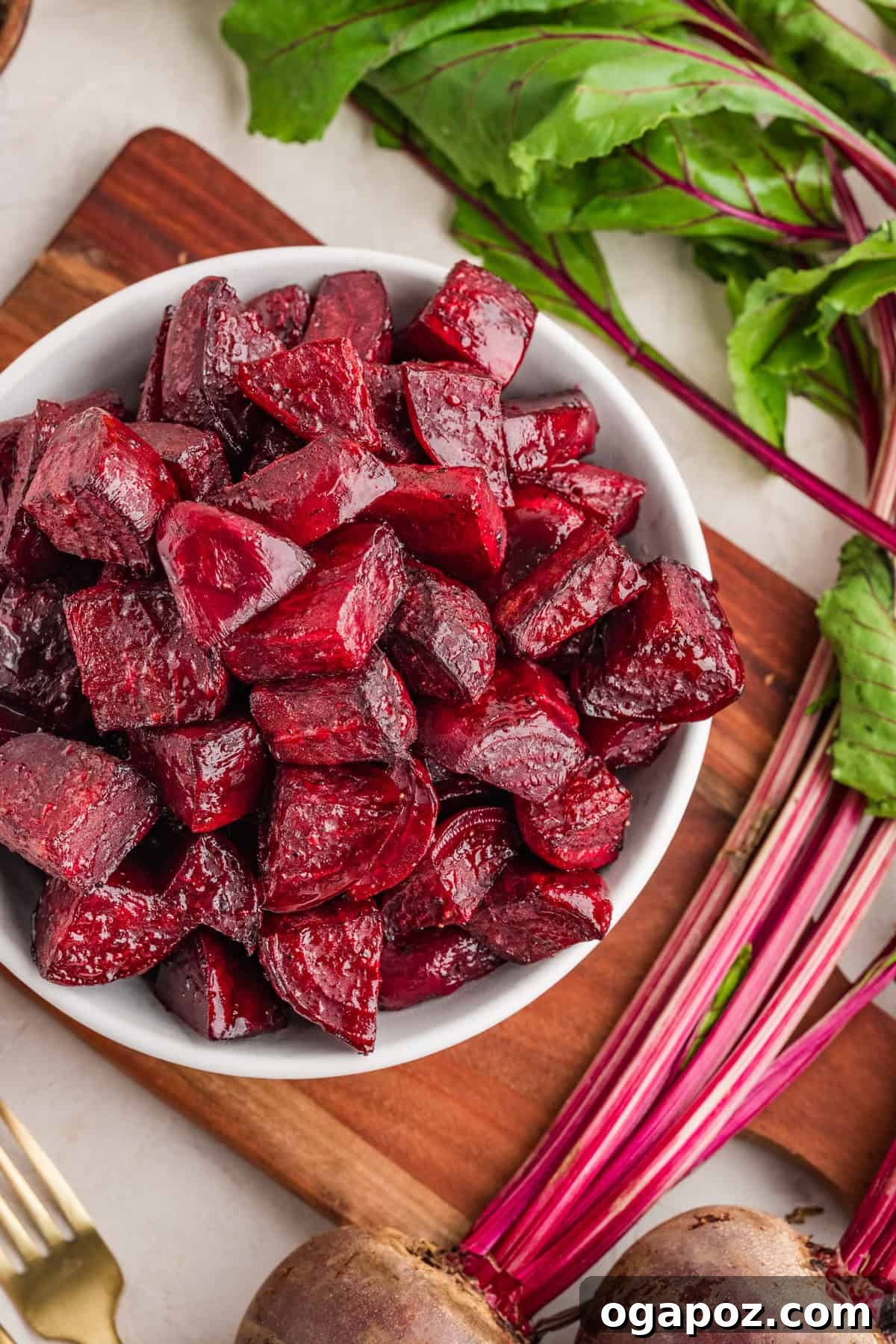 Quick Oven-Roasted Beets in 30 Minutes (No Foil) 2 Oven roasted beets on a white serving bowl with caramelized edges