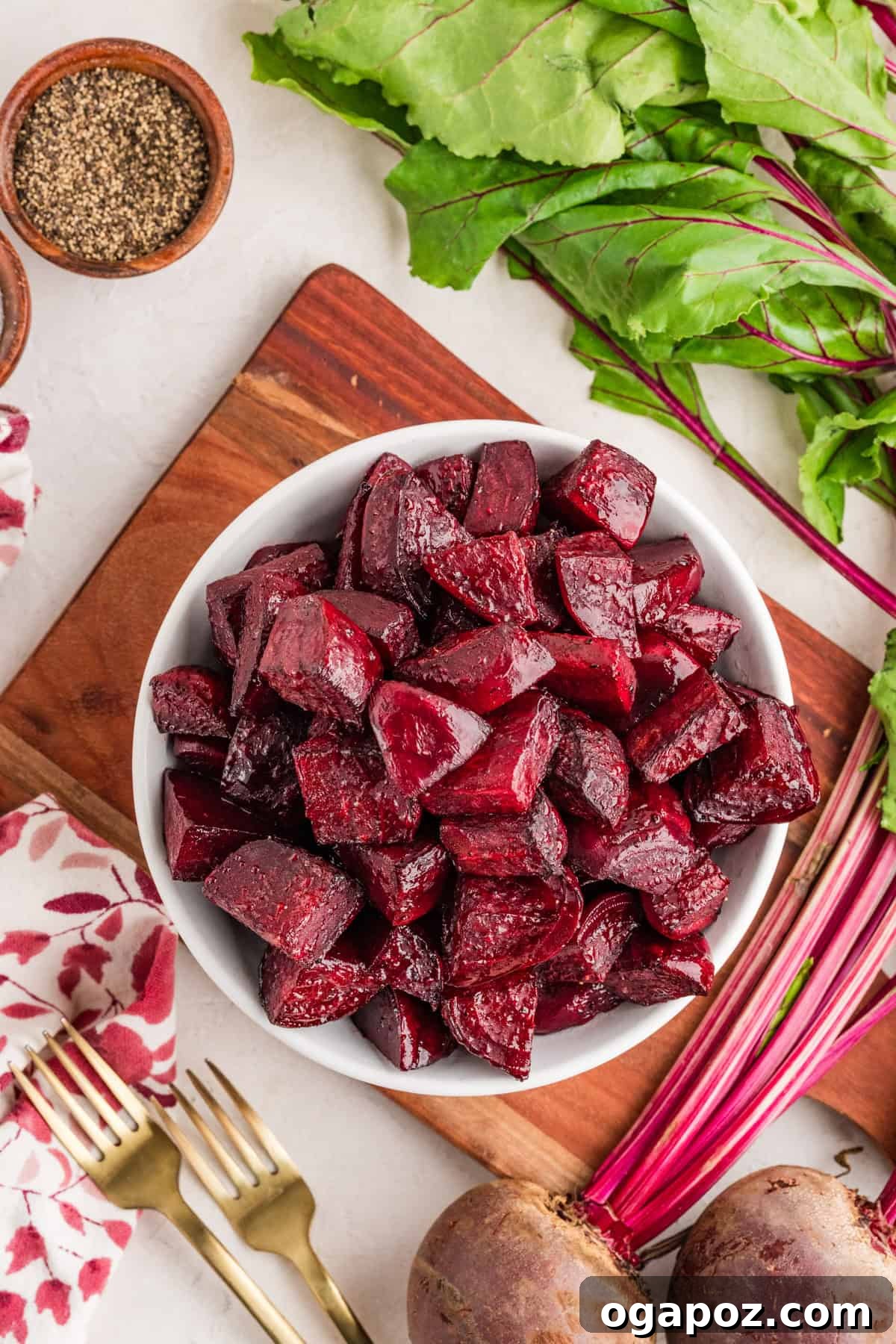 Quick Oven-Roasted Beets in 30 Minutes (No Foil) 6 Fork tender oven roasted beets served in a shallow bowl with olive oil drizzle