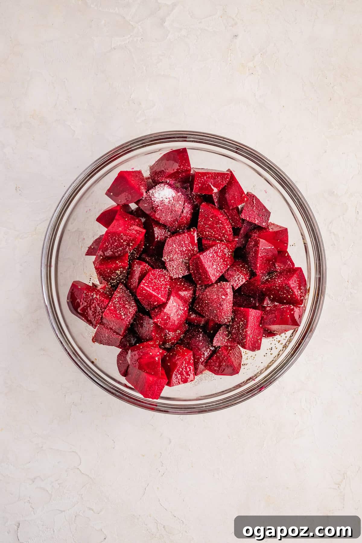 Quick Oven-Roasted Beets in 30 Minutes (No Foil) 7 Raw beet cubes tossed in olive oil and balsamic vinegar in a large mixing bowl