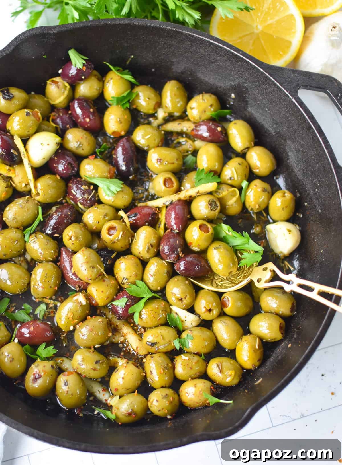 Warm Lemon-Herb Olives with Mediterranean Spices — 10-Minute Appetizer 2 Warm olives with lemon and Mediterranean herbs in a skillet