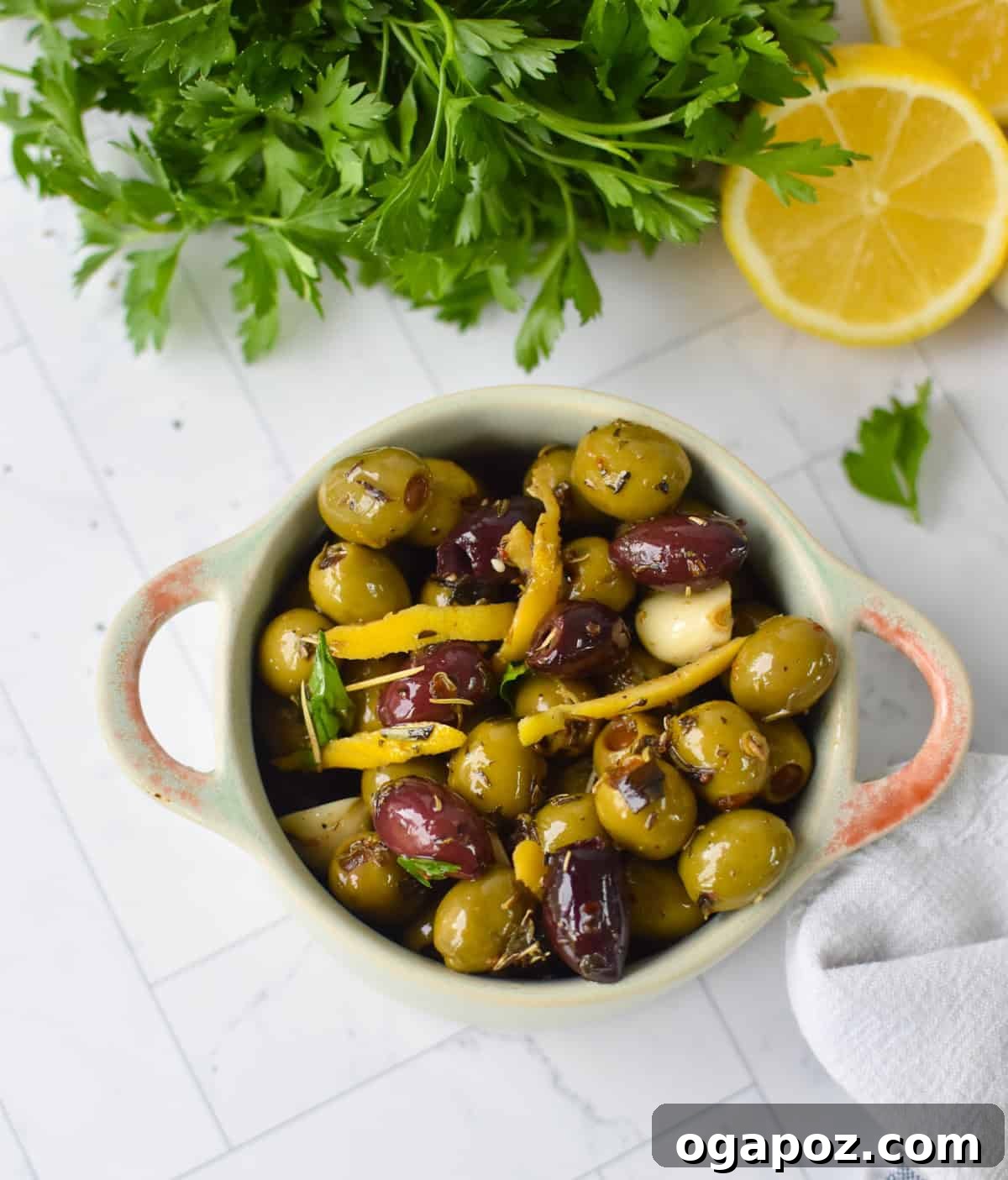 Warm Lemon-Herb Olives with Mediterranean Spices — 10-Minute Appetizer 9 Bowl of warm Mediterranean olives with fresh parsley garnish