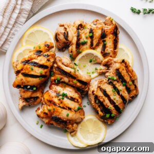 Marinated Grilled Boneless Chicken Thighs Juicy Every Time 11 Grilled chicken thighs with balsamic chicken marinade on a plate.