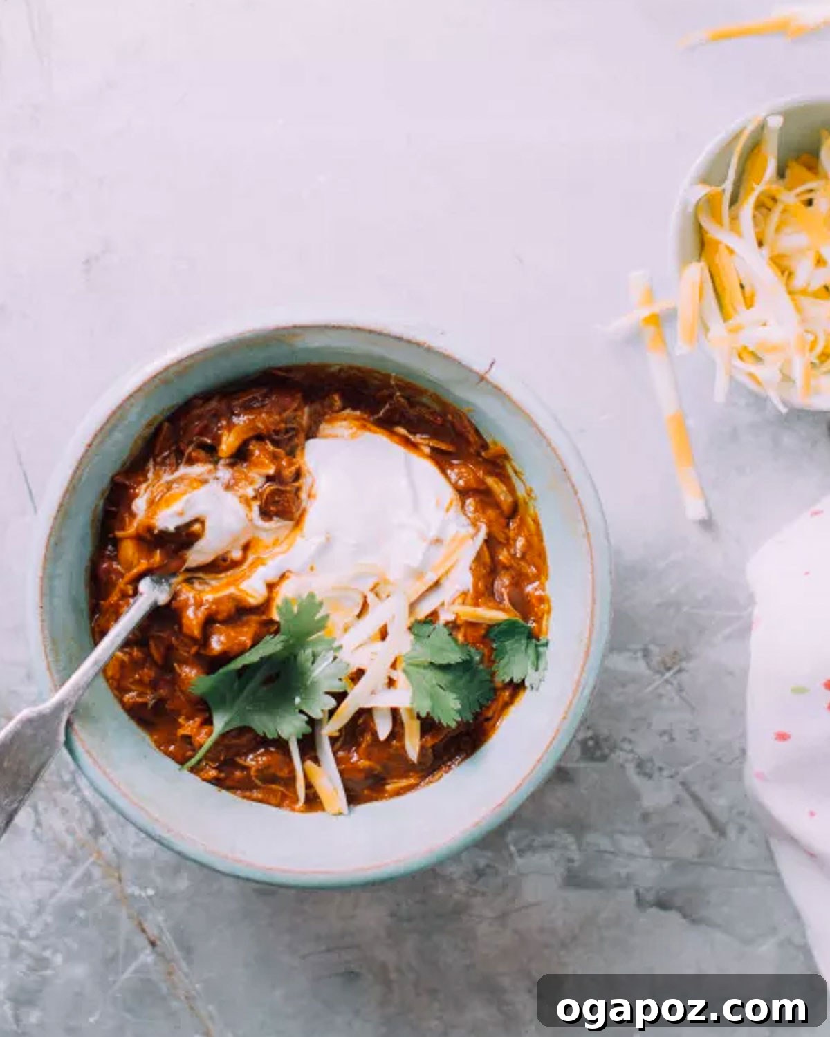 30 One-Pan Chicken Dinners: A Month of Simple Weeknight Recipes 25 Instant Pot chicken chili topped with cheese.