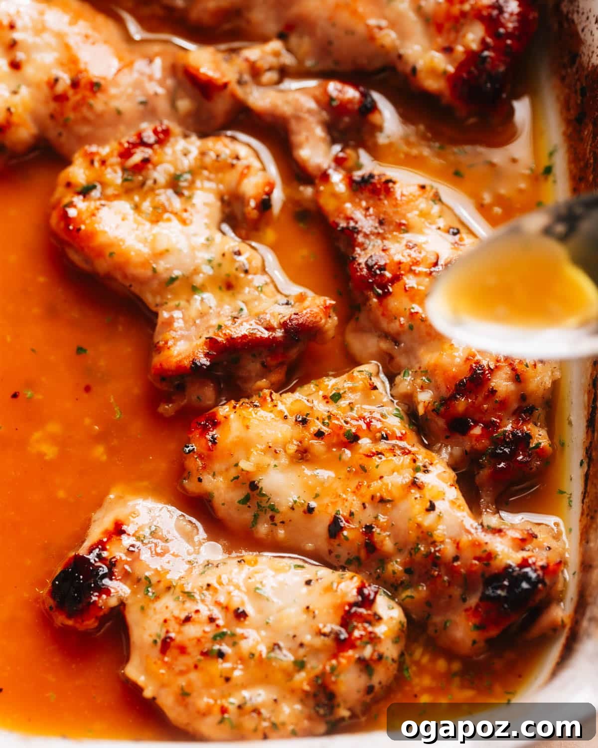 30 One-Pan Chicken Dinners: A Month of Simple Weeknight Recipes 7 Honey garlic lemon pepper chicken thighs in a baking dish.