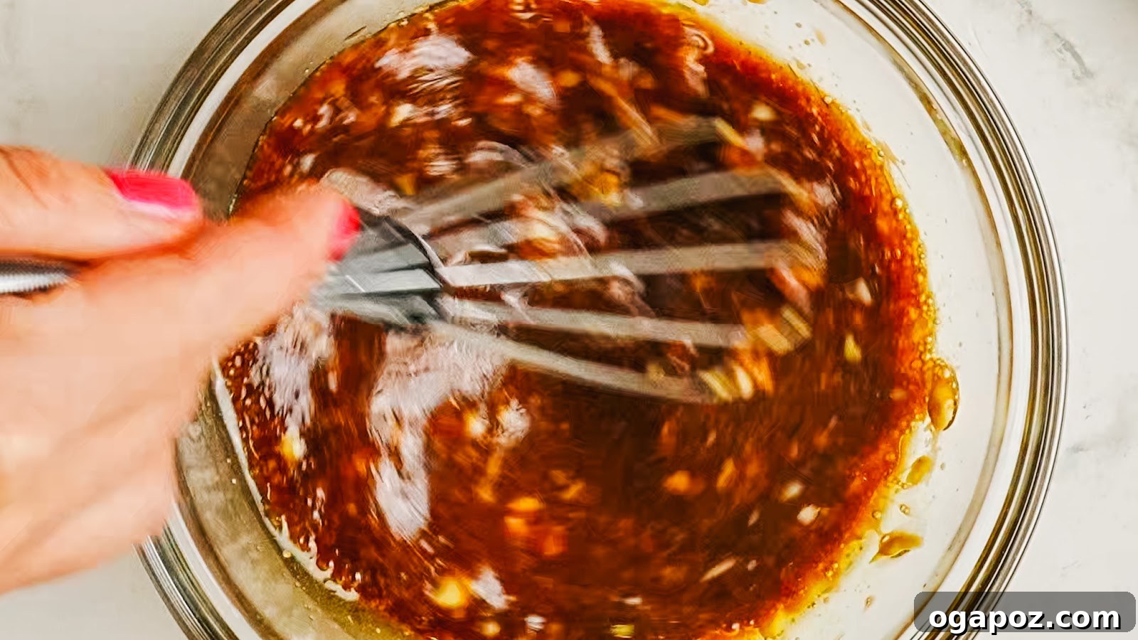 Tangy Balsamic Chicken Marinade for Juicy Grilled Chicken 6 Whisking the dark balsamic marinade in a bowl.