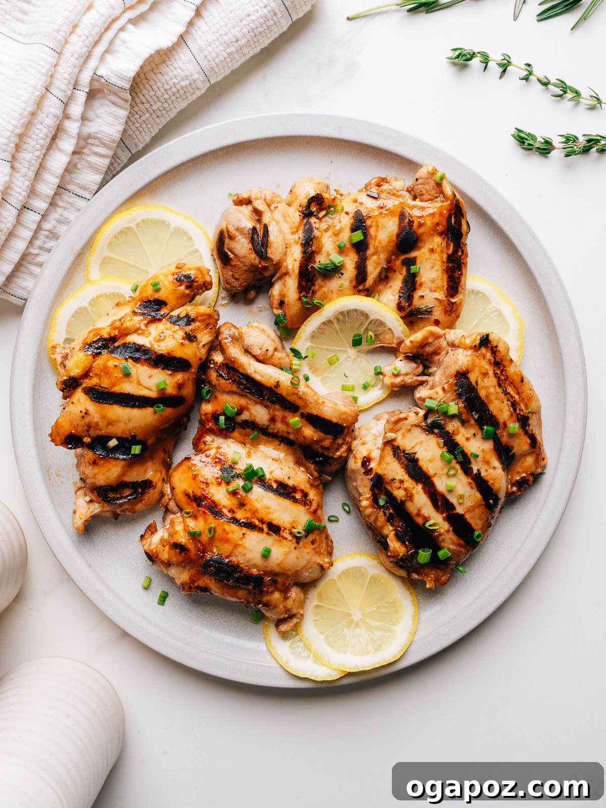 Tangy Balsamic Chicken Marinade for Juicy Grilled Chicken 9 Grilled chicken thighs with balsamic chicken marinade on a plate.