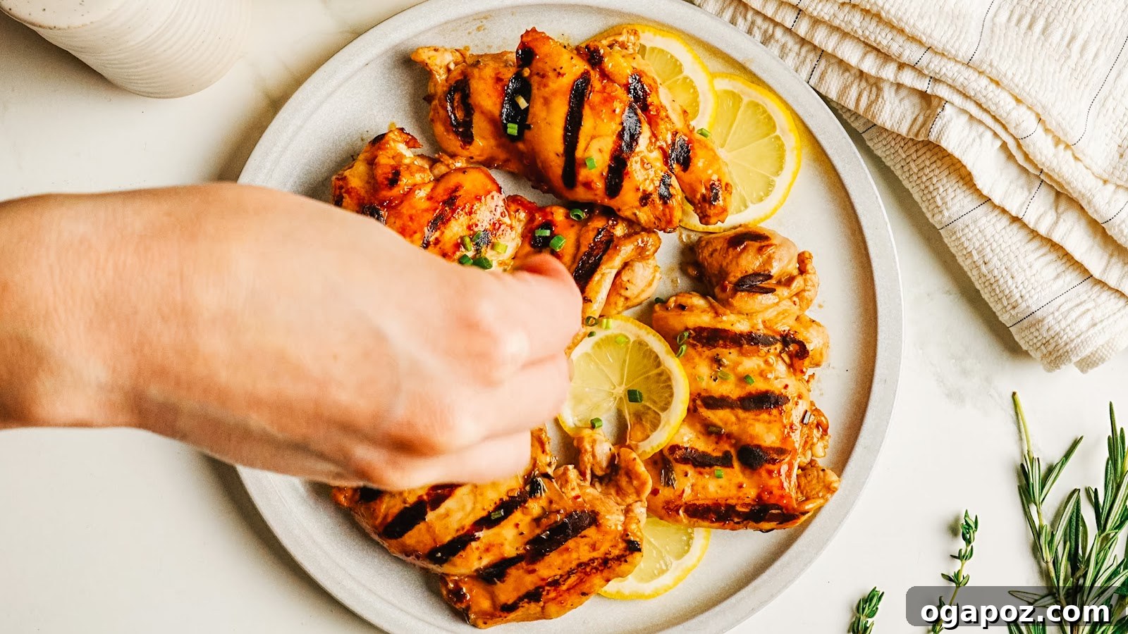 Tangy Balsamic Chicken Marinade for Juicy Grilled Chicken 10 Squeezing fresh lemon over grilled balsamic chicken.