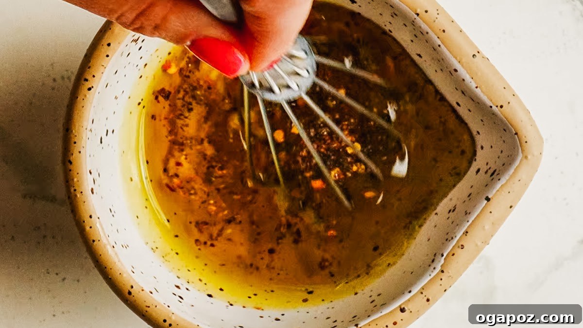 Grilled Eggplant with Garlic Oil and Whipped Feta 6 Whisking garlic oil marinade in a small bowl.