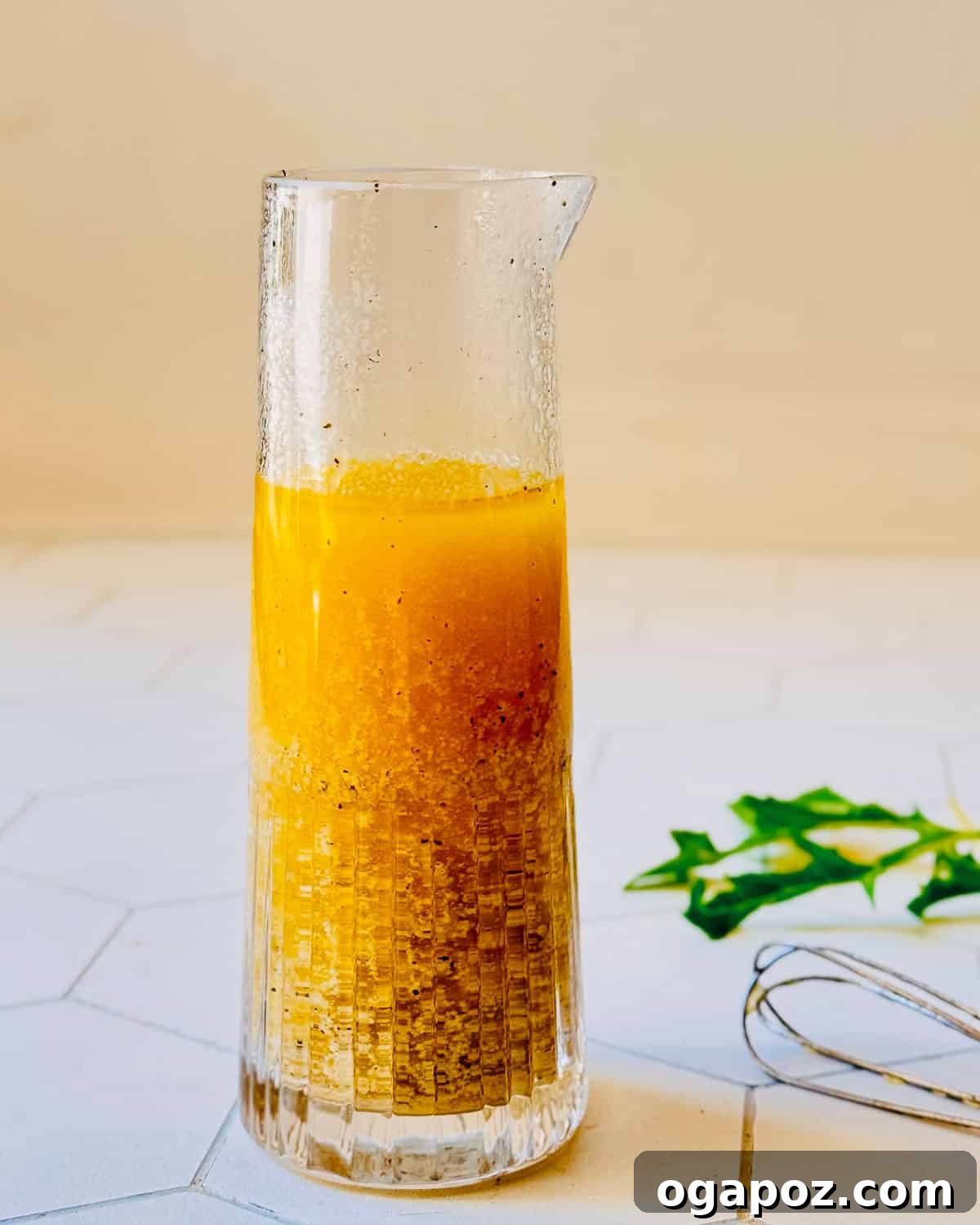 Tangy Dijon Vinaigrette Recipe for Fresh Salads 5 Dijon vinaigrette in a jar with a whisk
