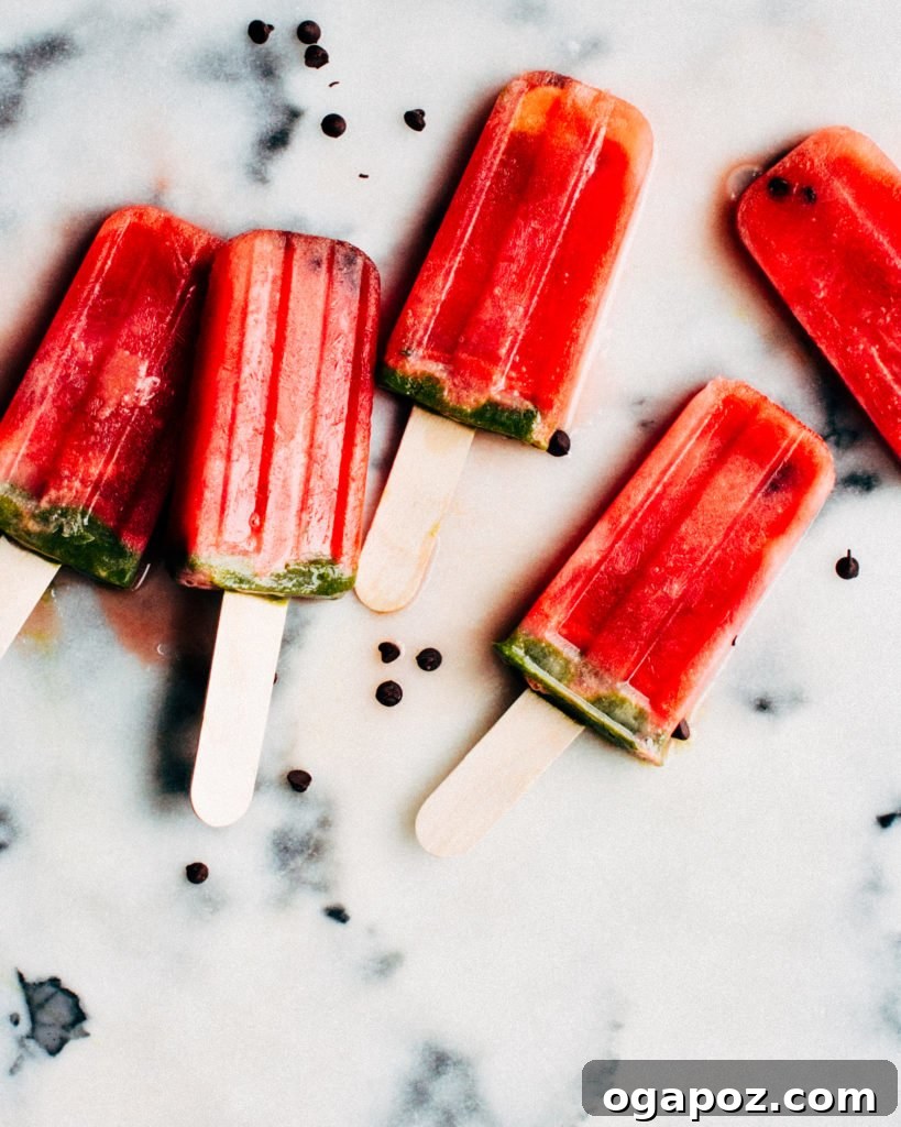 18+ Irresistible Frozen Treats: Homemade Popsicles and Ice Cream 3 Watermelon popsicles on a stick.