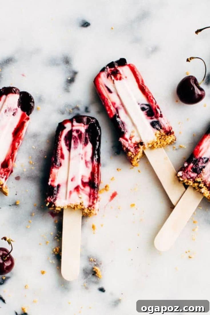18+ Irresistible Frozen Treats: Homemade Popsicles and Ice Cream 4 Cherry cheesecake popsicles with a graham crumble.