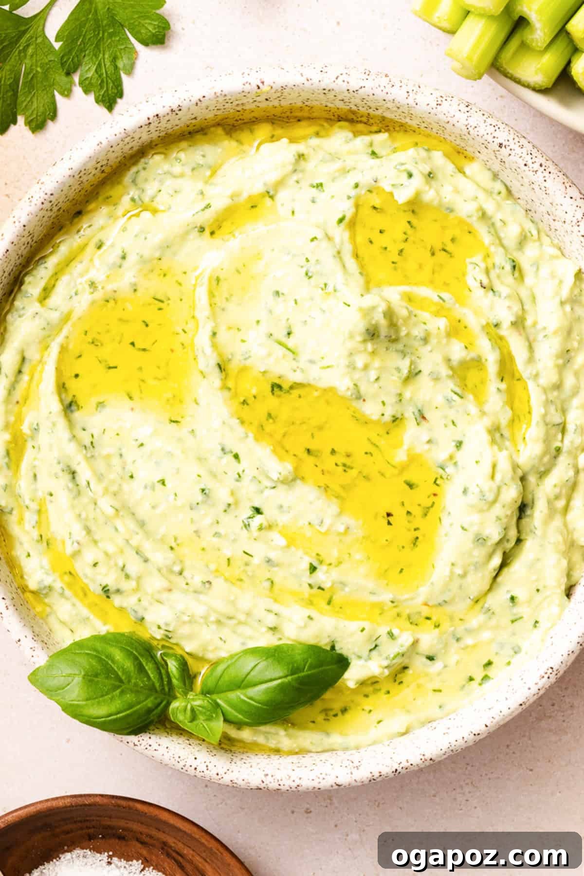 Creamy Green Goddess Dip for Vegetables, Chips & Sandwiches 6 lose up of creamy green goddess dip with feta showing smooth vibrant green texture and olive oil drizzle