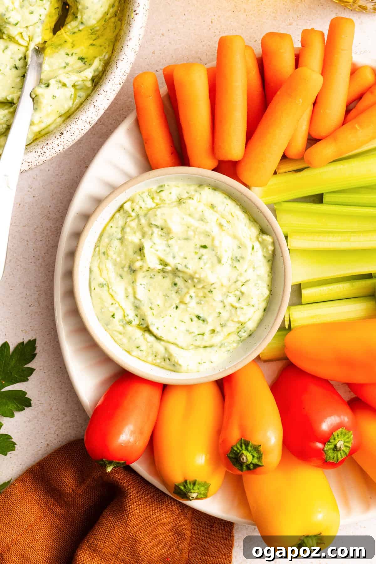 Creamy Green Goddess Dip for Vegetables, Chips & Sandwiches 10 Green Goddess Dip with carrots, celery and bell peppers surrouding the dip